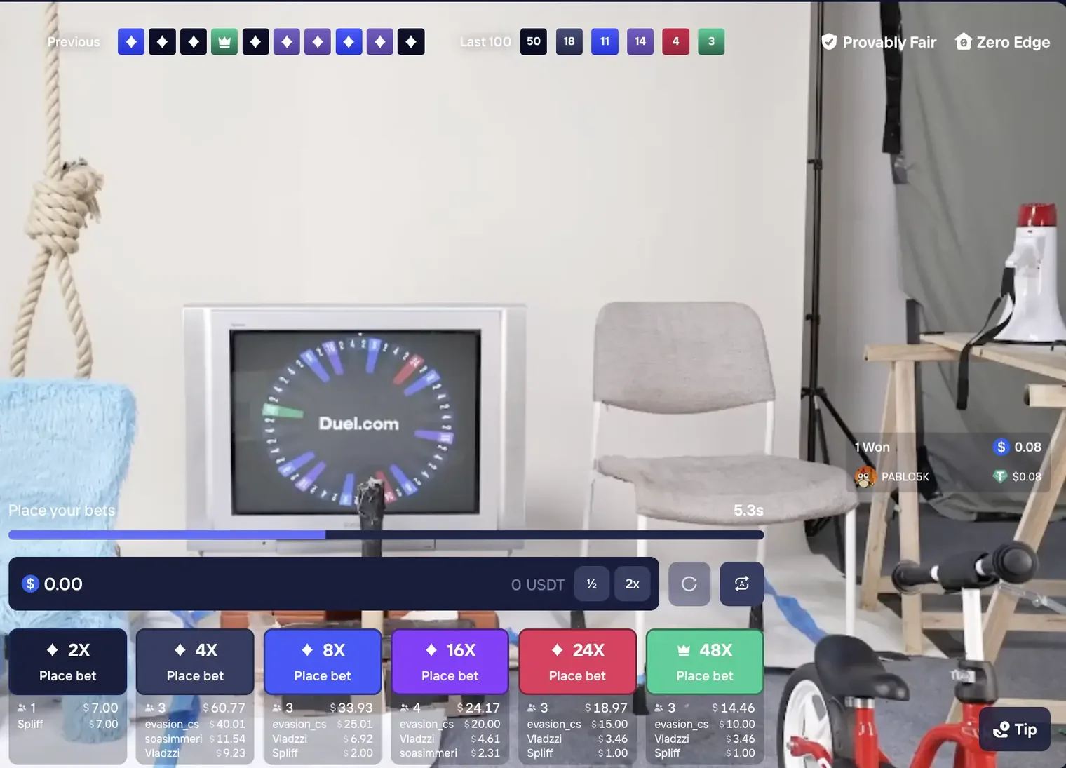 The Duel Castle Roulette table in play, showing the Previous strip of recent results coloured by tier, the Last 100 tally reading 50 · 18 · 11 · 14 · 4 · 3, the wheel running on a CRT television in the studio, and the six bet buttons from 2x to 48x