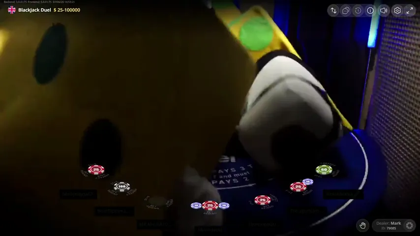 The camera frame filled entirely by yellow costume fabric at the Duel Blackjack table